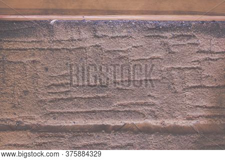 Vitnage Background Of A Wood Treshold With Dirty Carpet. Laundry Or Washhouse Advertising Concept