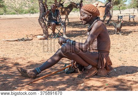 Epupa, Namibia - May 27, 2011: An Old Himba Man Posing For Photographers At A Himba Village Near Epu