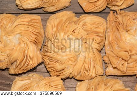 Top View Of Table With Fried Sweet Potato And Quince Cakes, Traditional Argentine