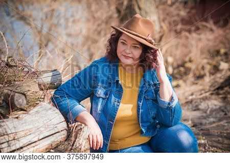 Mature Plus Size Woman, American Or European Appearance Walks And The  Enjoying Life. Lady With Exce