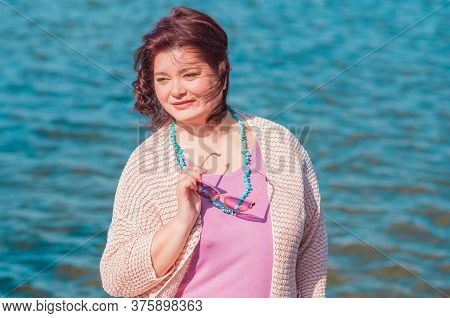 Mature Plus Size Woman, American Or European Appearance Walks And The  Enjoying Life. Lady With Exce