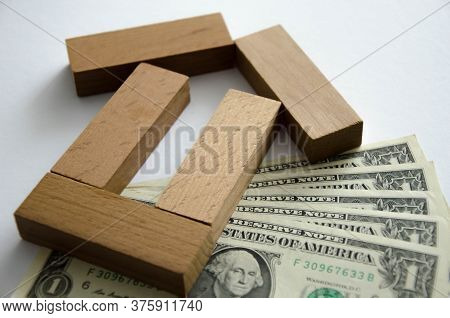Closeup Baby Tree With Coins On Old Wooden Background. Business Financce And Saving Money Concpt.