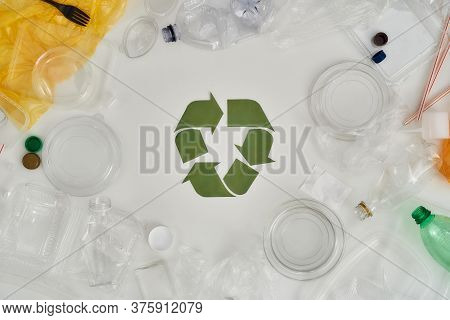 Flatlay Composition With Different Empty Plastic Bottles, Containers And Recycling Sign Made Of Pape