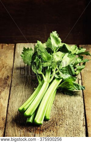 Fresh Celery Stalks, Vintage Wooden Background, Selective Focus