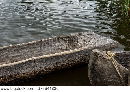 Two Dugout Canoes Made Of An Old Oak Tree Lying In The Water, A Stone Age Reconstruktion, Lejre Denm