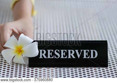 Reserved Metal Black Plate In A Restaurant. Reserved Metal Plate On The White Table. Vintage Photo P