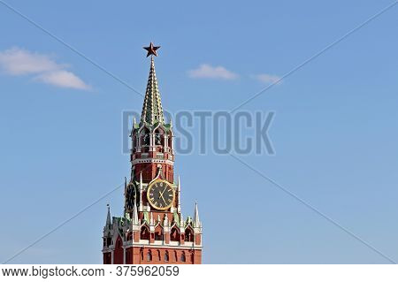 Chimes Of Spasskaya Tower, Symbol Of Russia On Red Square. Moscow Kremlin Tower Isolated On Blue Sky