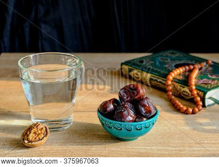 Walnut, Turquoise Piala With Traditional Oriental Pattern With Dates, Glass Of Clear Water, Stone Ro
