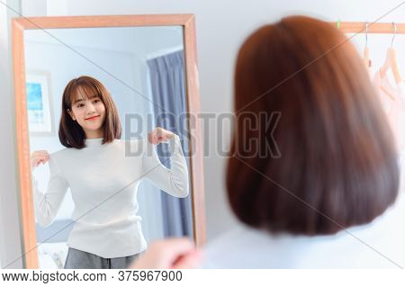 Asian Woman Dress-up At Home. Daily Lifestyle In The Bedroom. Social Distancing And Self-quarantine.