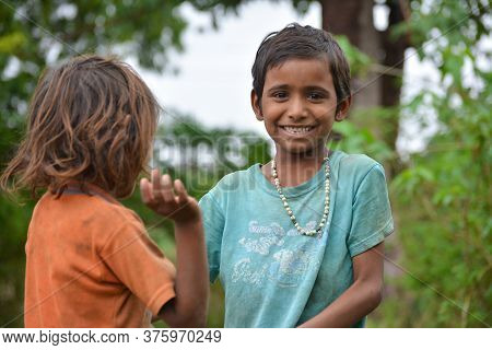Tikamgarh, Madhya Pradesh, India - July 12, 2020: Young Children Smiling And Having Fun From Rural P