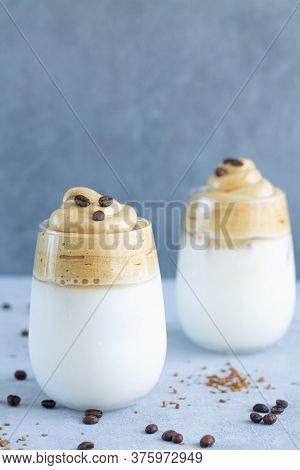 Iced Dalgon Coffee With Sweet Whipped Creamy Foam. Summer Drinks Concept