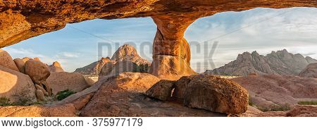 Panoramic Sunrise View From The Inside Of The Main Natural Granite Rock Arch At The Greater Spitzkop