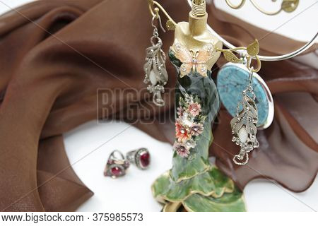 Beautiful Jewellery Close-up. Earrings, Neck Less And Rings On The Table. A Collection Of Jewelry. J