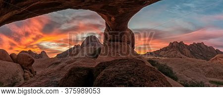 Panoramic Sunset View From The Inside Of The Granite Rock Arch At The Greater Spitzkoppe. The Greate