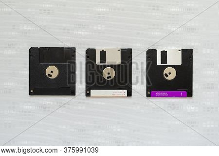3.5 Inch Magnetic Floppy Disks. Three Floppy Disks On White Backgrounde. Obsolete Digital Data Stora