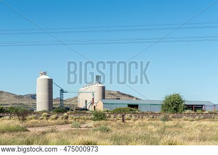 Prieska, South Africa - Mar 1, 2023: Grain Silos In Prieska In The Northern Cape Province. A Railway
