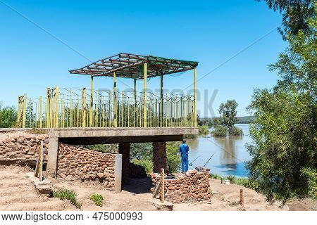 Douglas, South Africa - Mar 1, 2023: Angler At Samevloeiing Near Douglas Where The Orange And Vaal R