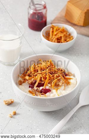 Rice Pudding With Norwegian Brunost Traditional Brown Cheese And Raspberry Jam