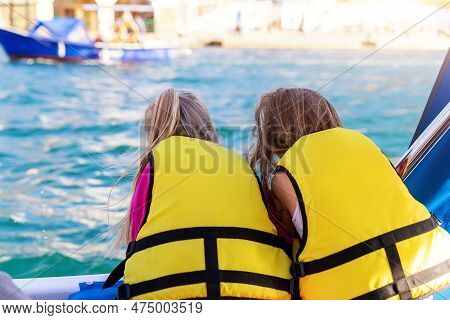 Back View Two Cute Little Blond Happy Excited Smiling Caucasian Girl Friends Wear Lifevest Enjoy Sai