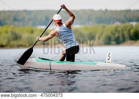 Male Athlete Canoeist On Canoe Single Rowing Kayaking Race, Summer Outdoors Sports