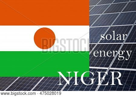 Solar Energy Panels With Niger Flag Background.  Sustainable Resources And Renewable Nigerien Energy