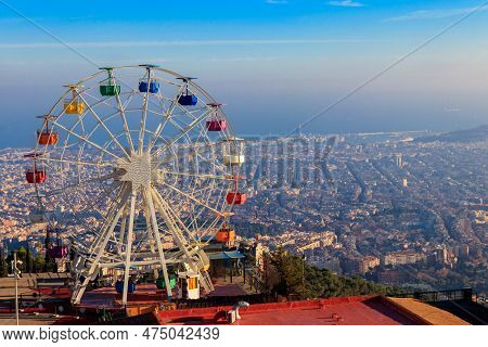 Ferris Wheel In Tibidabo Mount With Panoramic View Over Barcelona, Catalonia, Spain