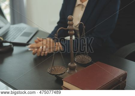 Judge Gavel With Justice Lawyers Having Team Meeting At Law Firm Background. Concepts Of Law And Leg