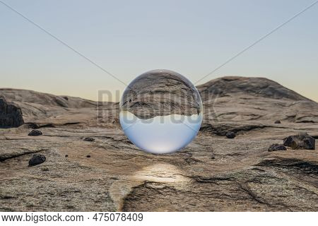 Glas Sphere Ball Hovering In The Air In Large Empty Desert Environment; Abstract Surreal Concept; 3d
