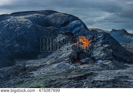 Opening Of A Volcanic Crater During The Day. Crater With Some Lava Flow. Volcanic Landscape On Icela
