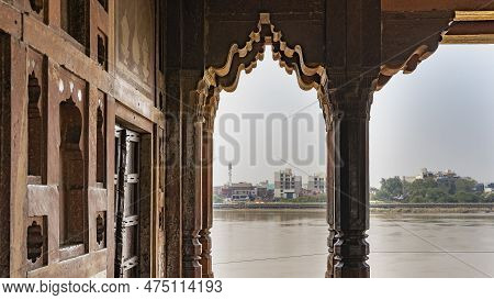 Ancient Indian Architecture. The Walls And Columns Of Red Sandstone Are Decorated With Carvings. Thr