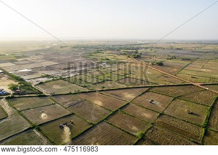 Drone Shot Of Tractor Winnowing Grain In Many Square Farms Feilds With Six Lane Delhi, Jaipur, Surat