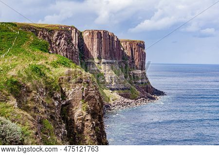 Red Kilt Rock And Mealt Falls In Isle Of Skye, Scotland With The Sky And Sea In Spectacular Colors
