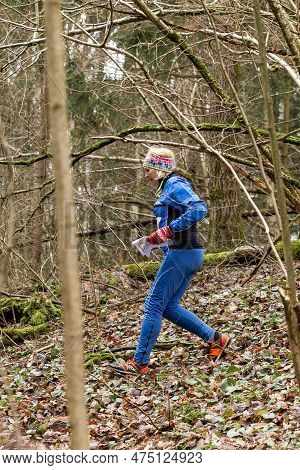 Cute Elderly Caucasian Women Wearing Sportswear Running Through A Forest