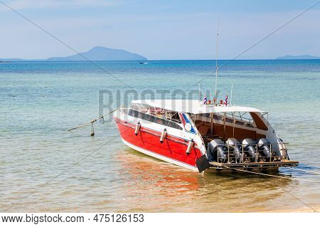 Speed Boat Moored To The Pier Of Rawai Beach In Thailand To Transport Tourists To The Phi Phi Island