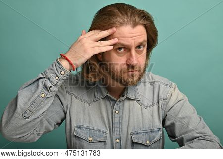 Man In Front Of Mirrror Looking At His Wrinkles