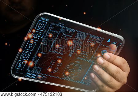Man Controlling Home Through The Dashboard Digital Tag. Concept Of Smart Home And Control All Device