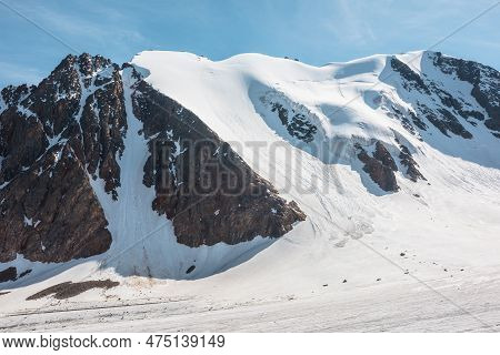 Scenic Mountain Landscape With Glacier Under Sharp Rocks In Sunlight. Awesome Alpine Landscape With 