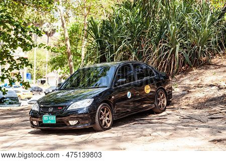 Thailand, Nai Harn - 03.30.23: Black Honda Civic On The Road Near The Cafe