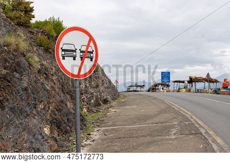 Prohibit Overtaking Sing Post On A Road Side In The Hilly Mountain Area