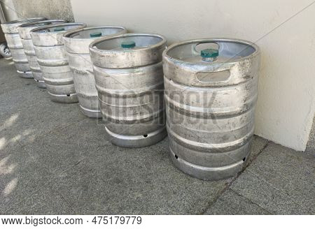 Beer Kegs Placed Downtown Street. Beverage Distribution Concept