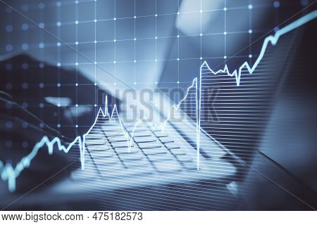 Close Up Of Hands Using Laptop Kyeboard With Growing Blue Financial Forex Chart On Blurry Background