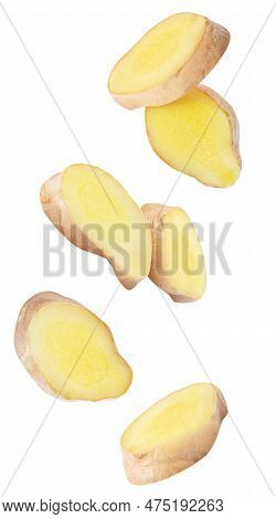 Isisolated Ginger Pieces In The Air. Raw Ginger Slices Falling Down Isolated On White Background Wit