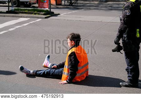 Berlin, Germany - April 24, 2023: Protesters From The Group Last Generation Sitting On The Street An
