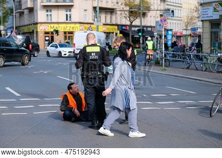 Berlin, Germany - April 24, 2023: Protesters From The Group Last Generation Sitting On The Street An