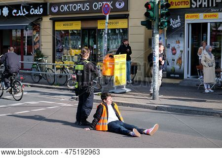 Berlin, Germany - April 24, 2023: Protesters From The Group Last Generation Sitting On The Street An