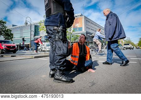 Berlin, Germany - April 24, 2023: Protesters From The Group Last Generation Sitting On The Street An