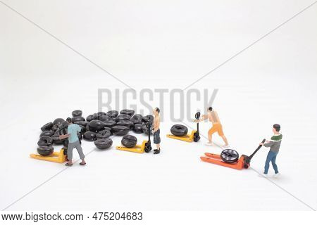 A Worker Using Pallet Jack To Lift Heavy Roasted Coffee Bean