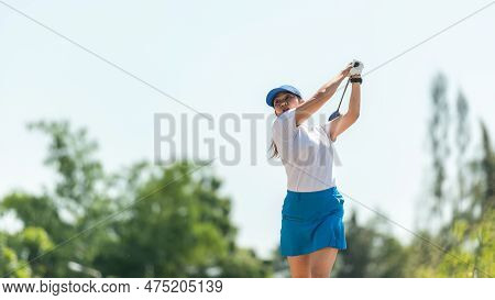 Golfer Sport Course Golf Ball Fairway. People Lifestyle Woman Playing Game Golf Tee Off On The Green