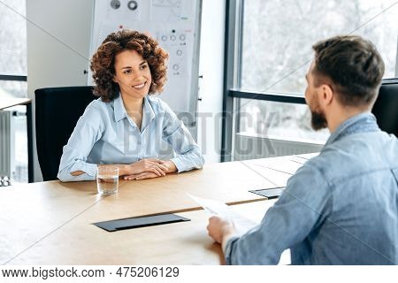 African American Woman Is Hired On A New Job. Two People Sitting At A Desk In Office, Have Successfu