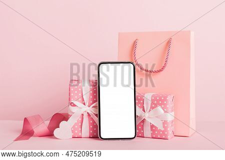 Mobile Phone With Blank Screen On Colored Background With Hearts, Calendar And Gift Box, Valentine D